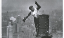 worker-on-empire-state-building-signaling-the-hookman